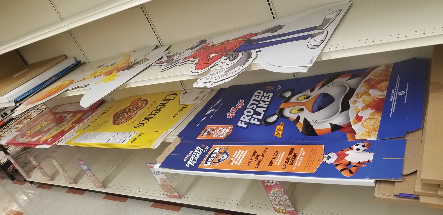 CEREAL ISLE: Flattened promotional items line some shelves, ready to be popped into place once products arrive.